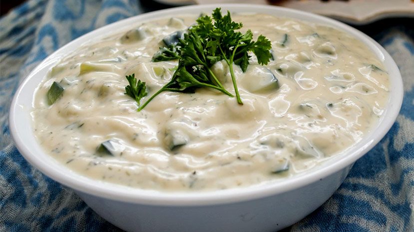 It's served on the side with warm pita bread triangles for dipping, and is also used as a condiment for souvlaki